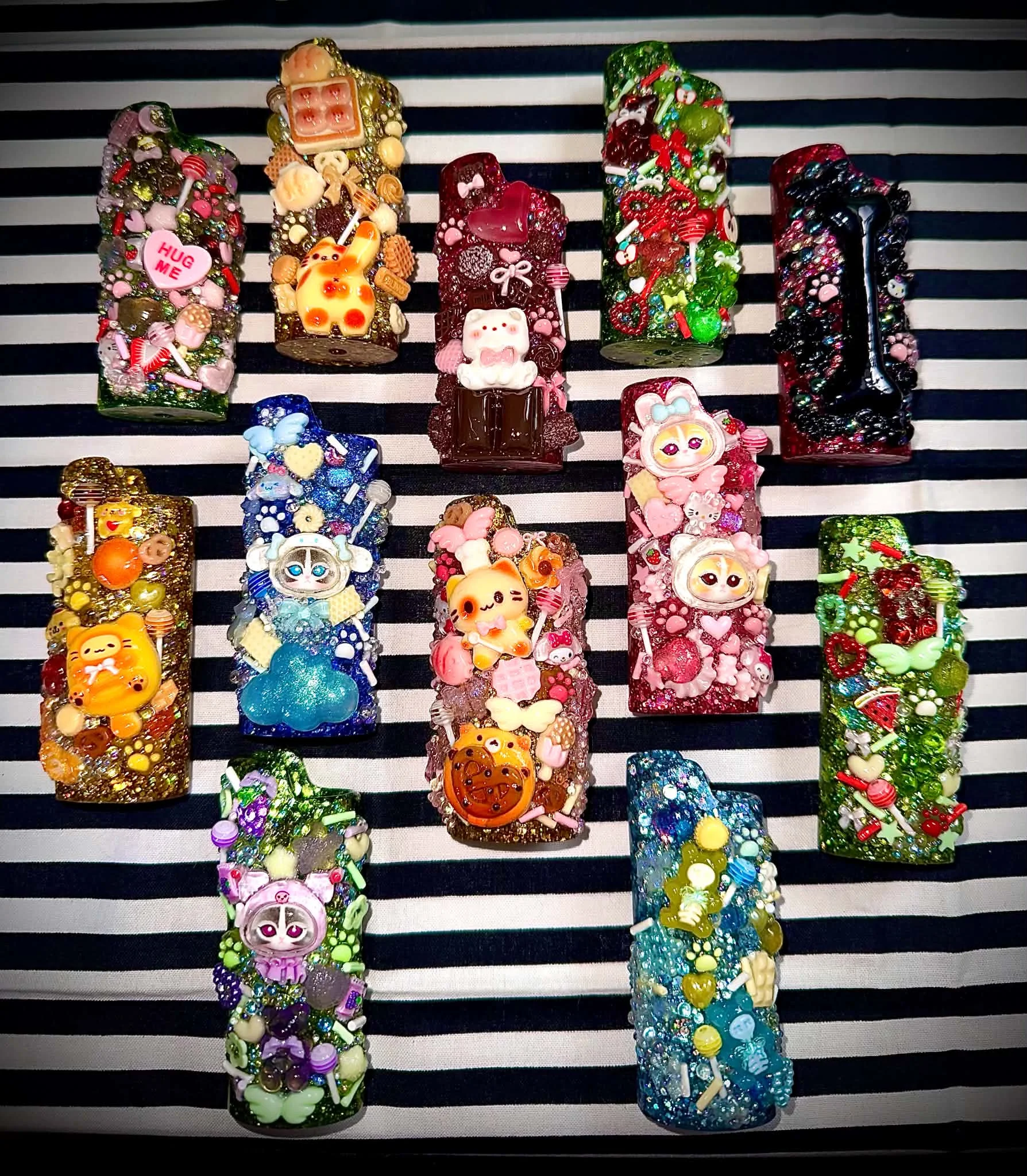 Custom lighter cases arranged as a colourful collection