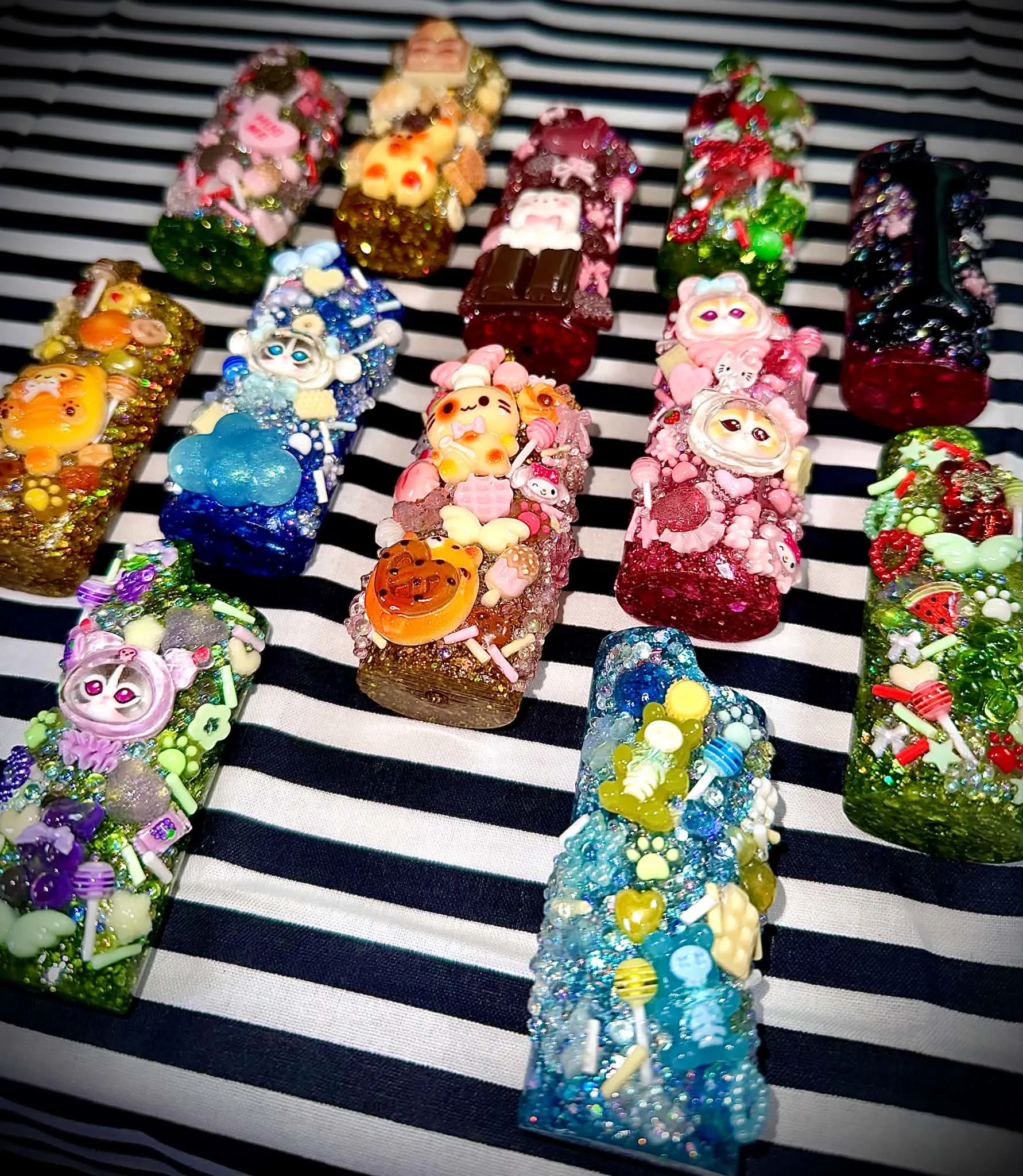 A lineup of colourful custom lighter cases